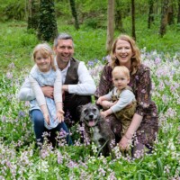 Team Toll amongst the bluebells. Family pets are welcome too!. Family at woodland naming ceremony in Oxfordshire